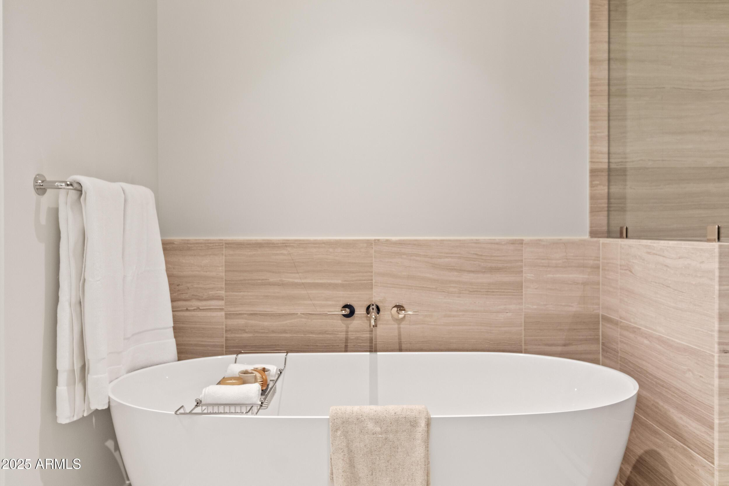 5000 North Camelback Ridge Drive, Unit 302 Scottsdale, AZ 85251 - Photo 22 of 42 a bath tub sitting in a bathroom