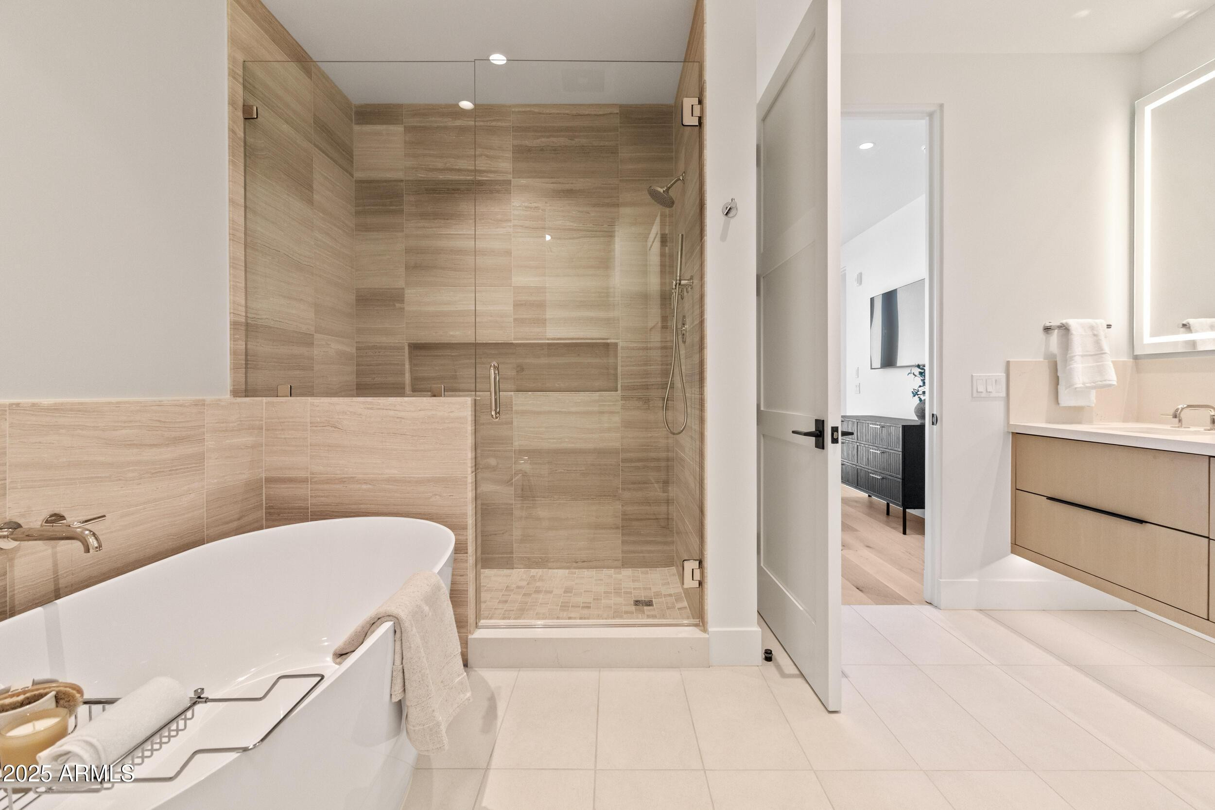 5000 North Camelback Ridge Drive, Unit 302 Scottsdale, AZ 85251 - Photo 23 of 42 a bathroom with a bathtub and a shower