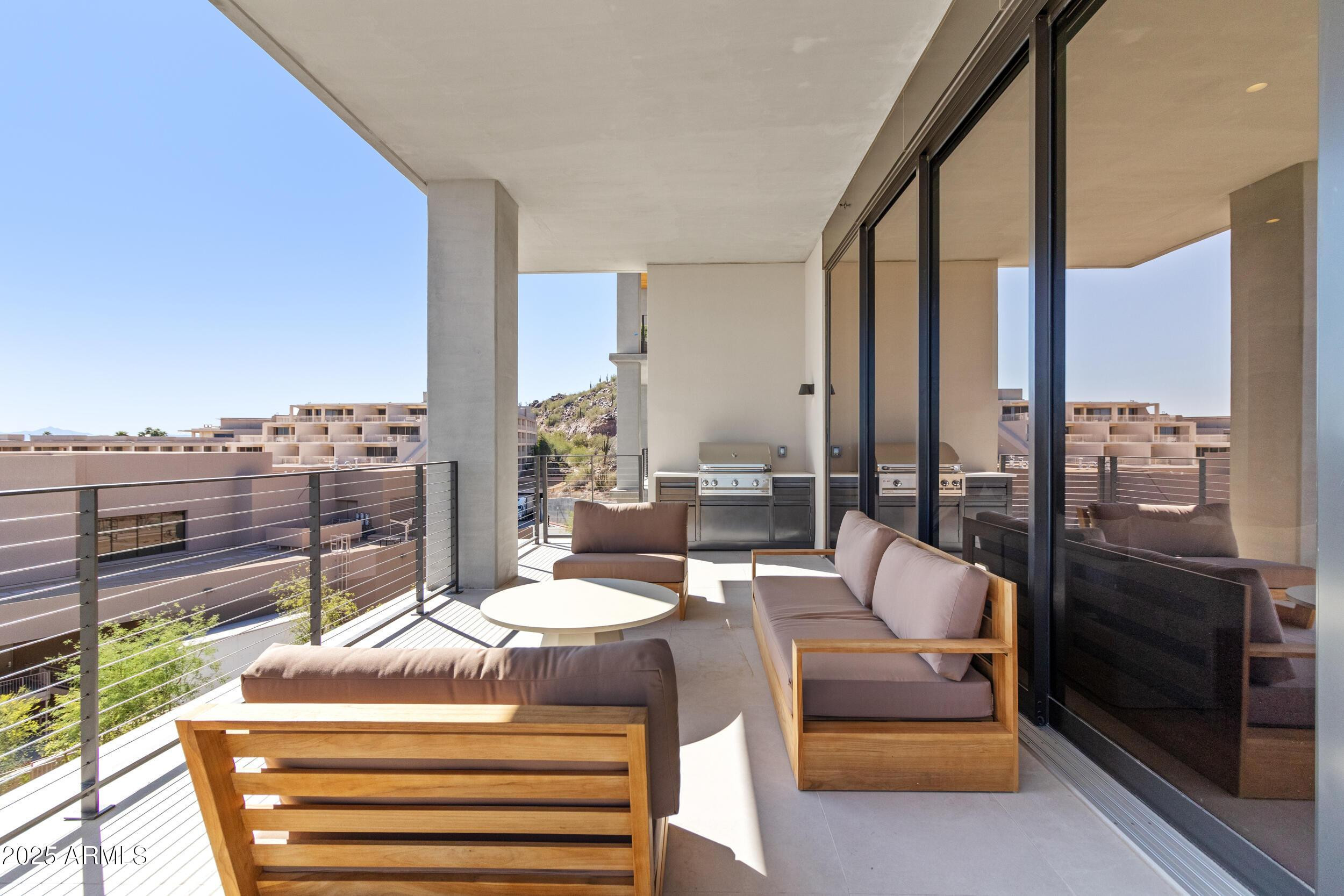 5000 North Camelback Ridge Drive, Unit 302 Scottsdale, AZ 85251 - Photo 28 of 42 a outdoor space with patio the couches and chairs