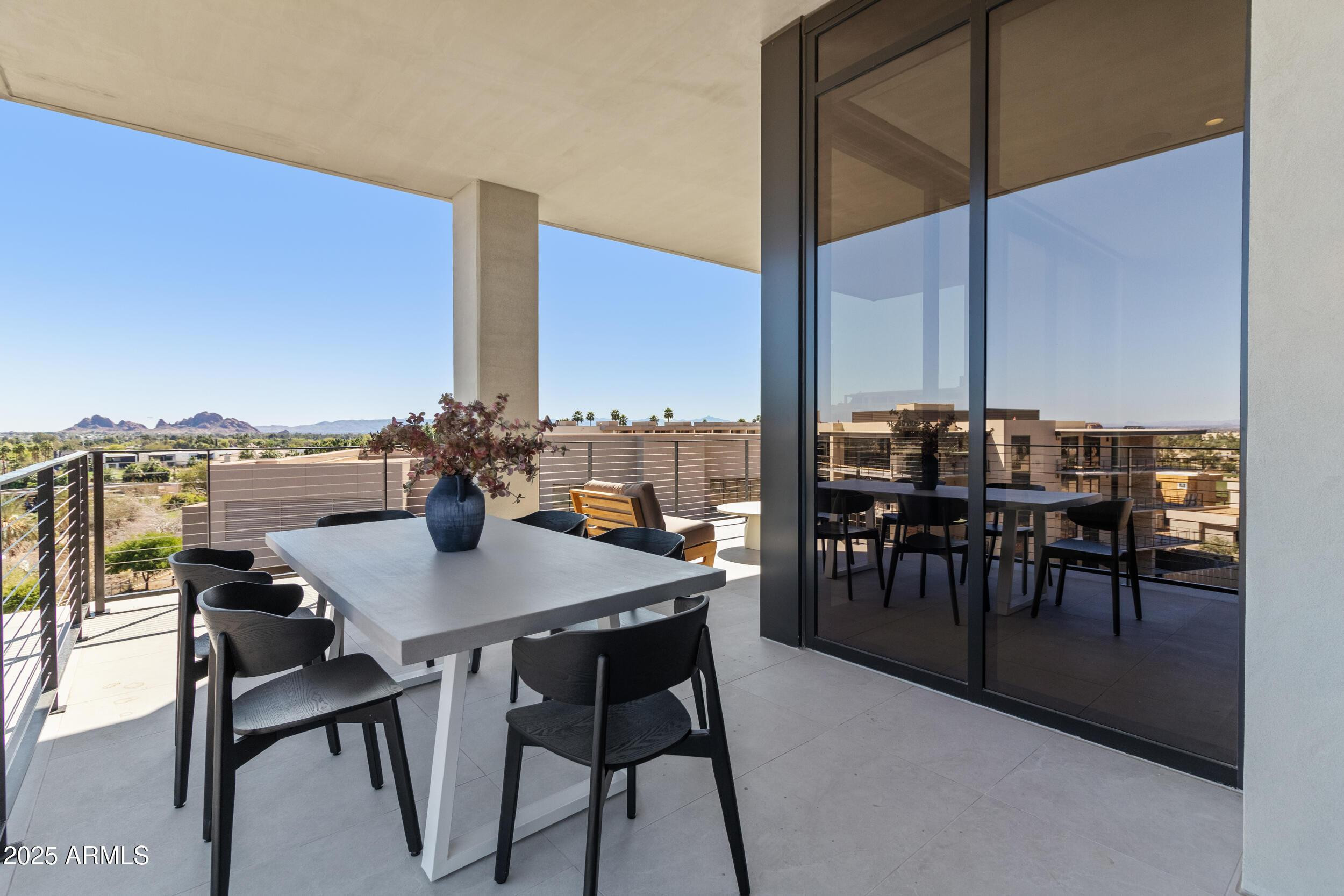 5000 North Camelback Ridge Drive, Unit 302 Scottsdale, AZ 85251 - Photo 32 of 42 a view of a dining room with furniture and window
