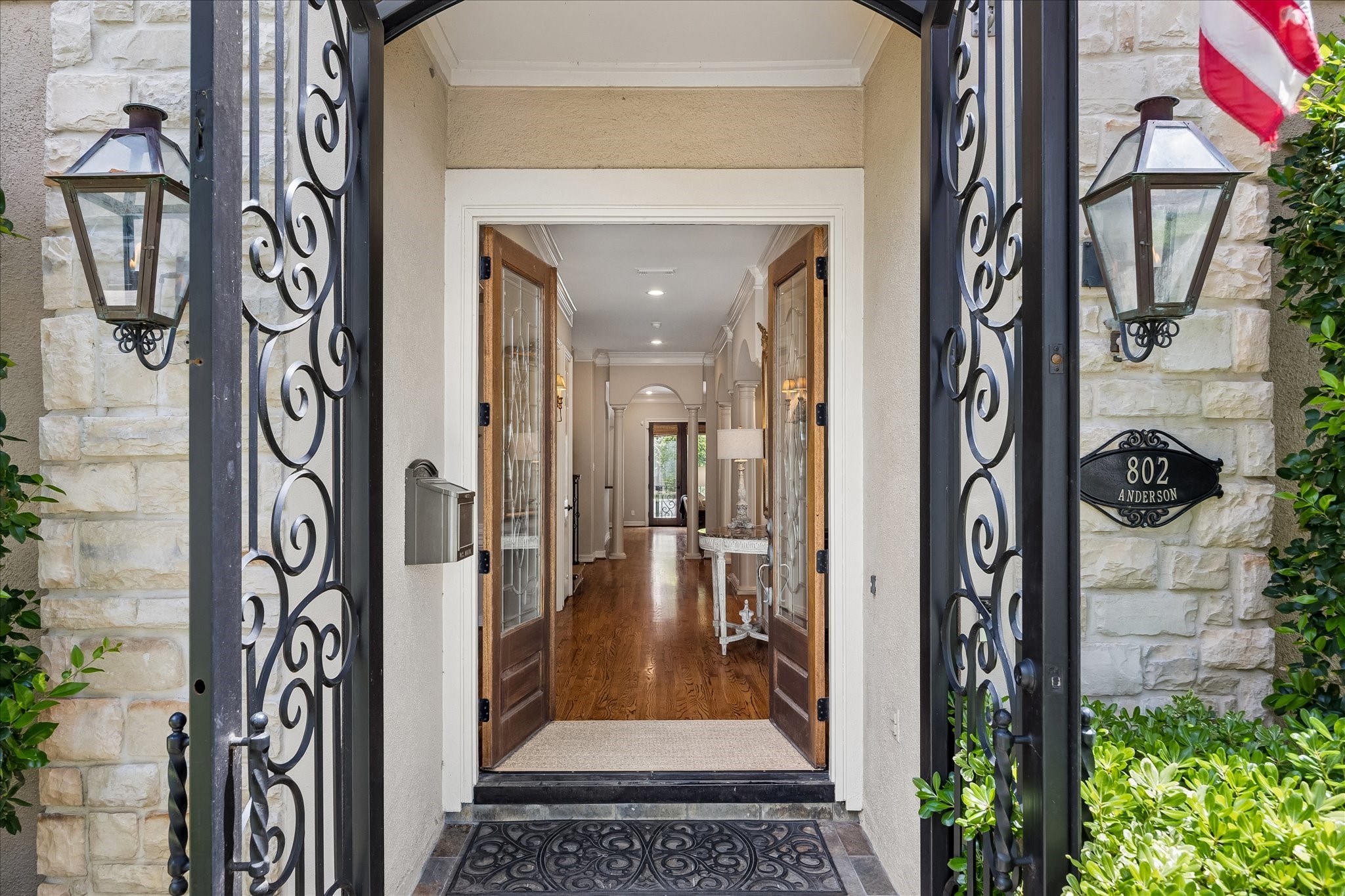 802 Anderson Street Bellaire, TX 77401 - Photo 5 of 36 Enter the home through beautiful wrought iron exterior doors that lead you to the double beveled glass and wood doors.