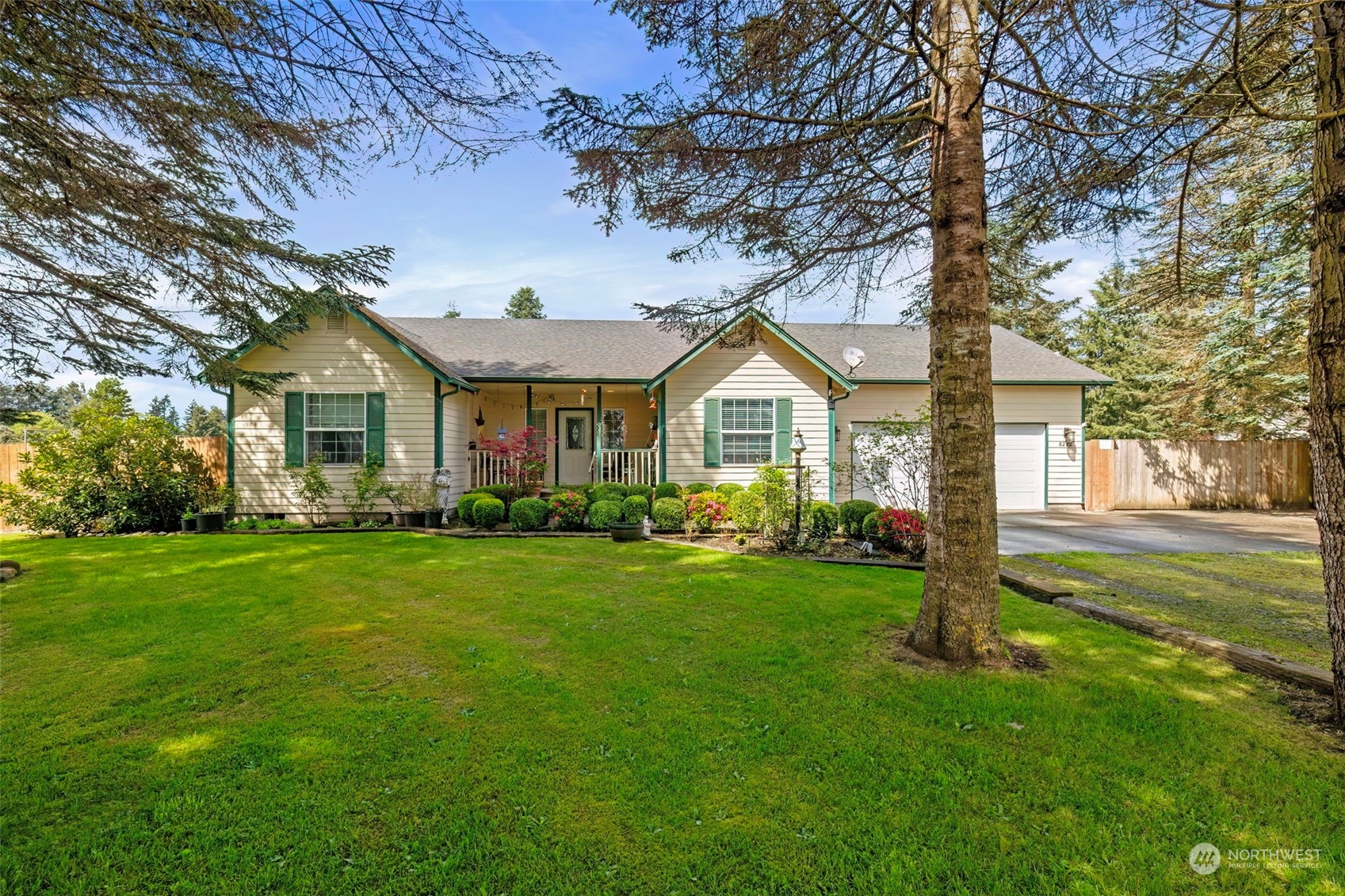 a front view of a house with a garden