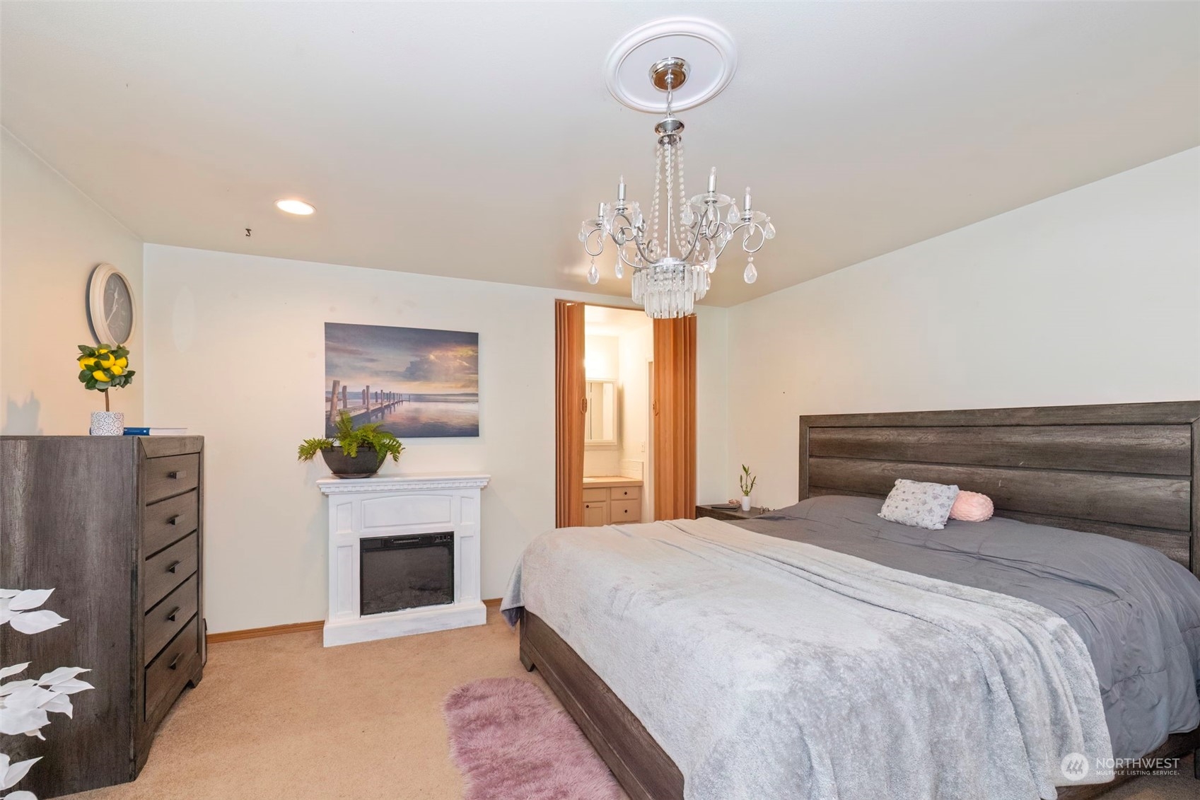 8222 178th Avenue Southwest Rochester, WA 98579 - Photo 18 of 36 a bedroom with a bed and a fireplace