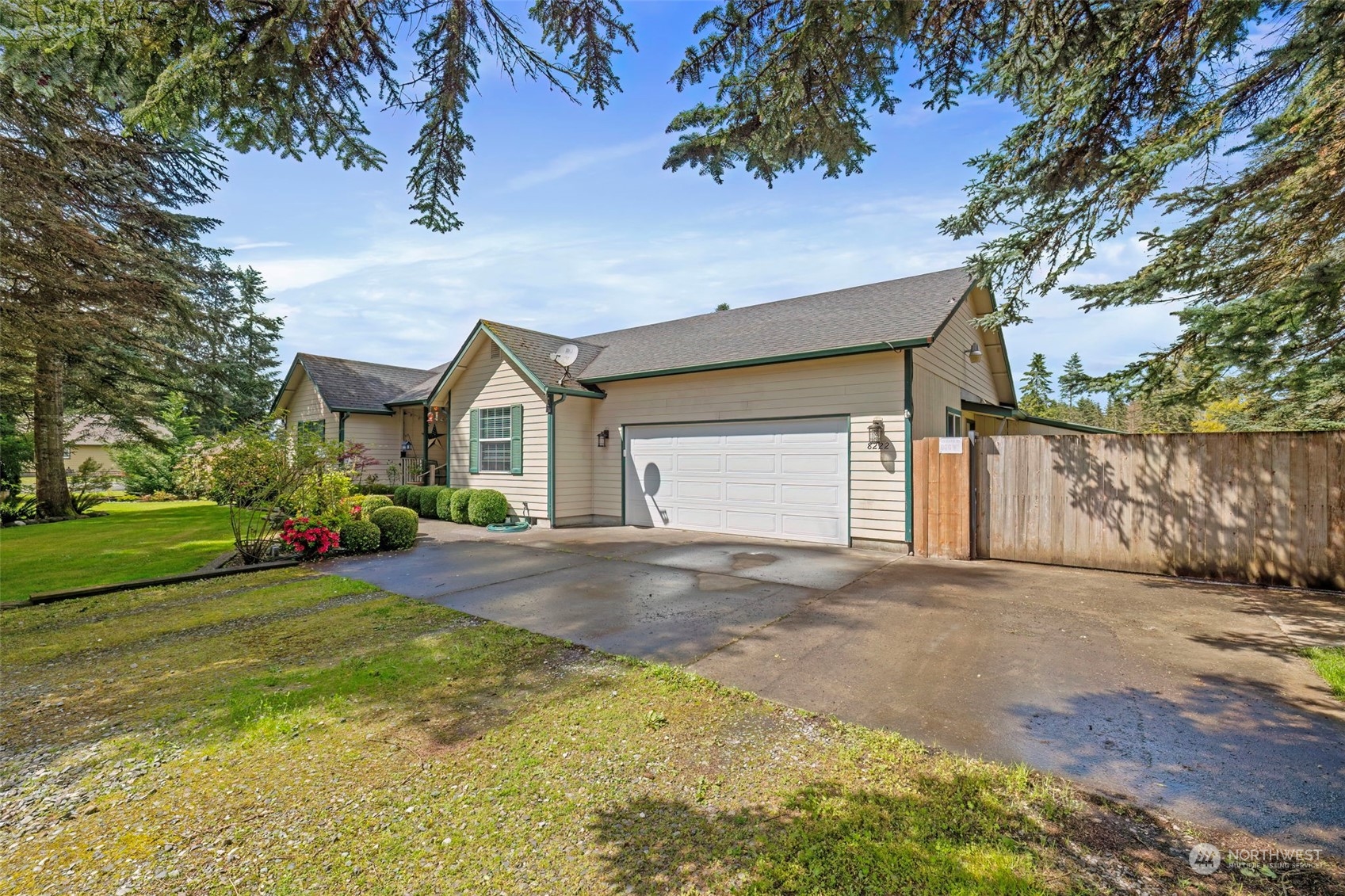 8222 178th Avenue Southwest Rochester, WA 98579 - Photo 2 of 36 a view of a house with a yard and garage