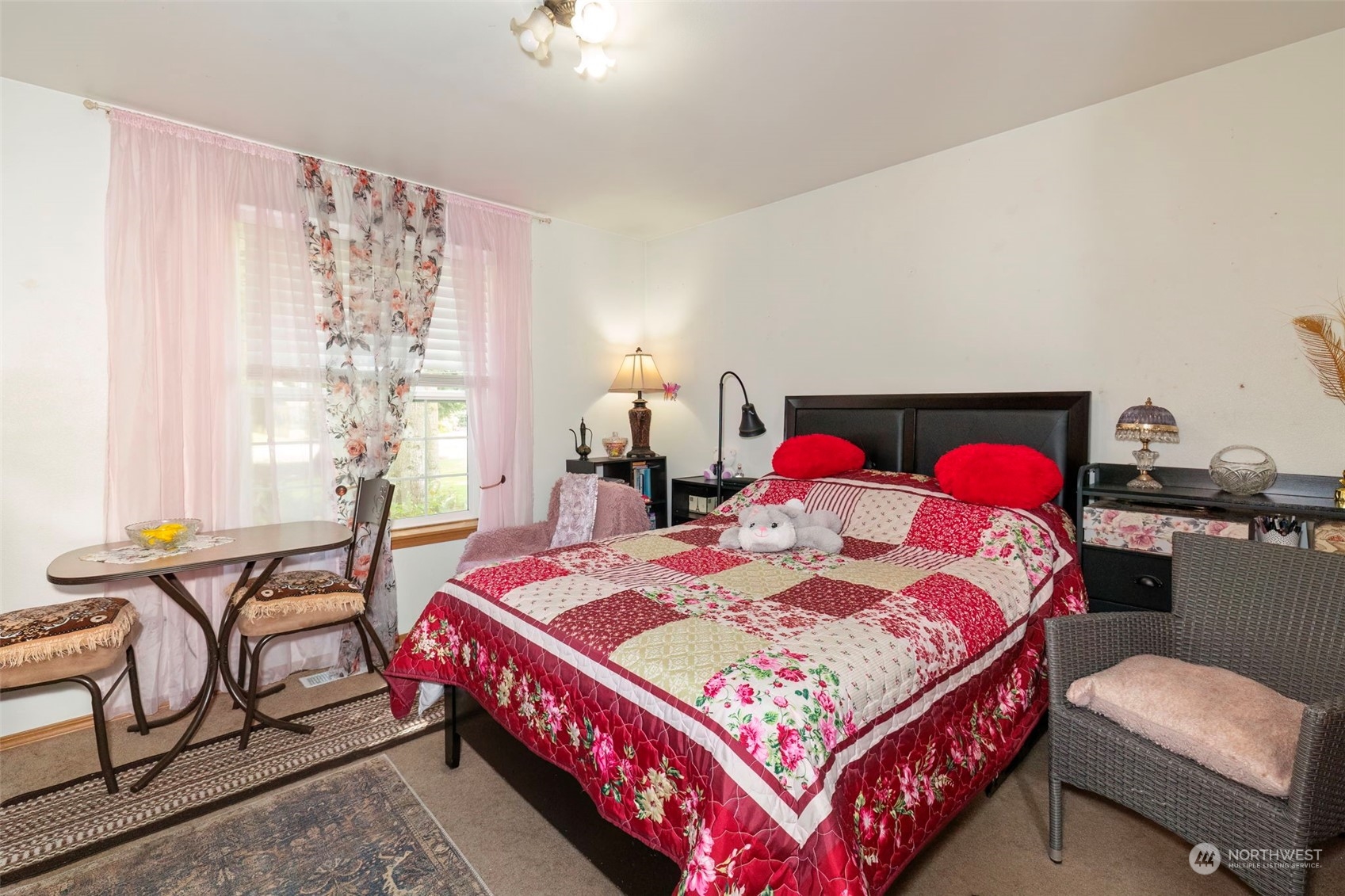 8222 178th Avenue Southwest Rochester, WA 98579 - Photo 22 of 36 a bedroom with a bed a lamp and a window