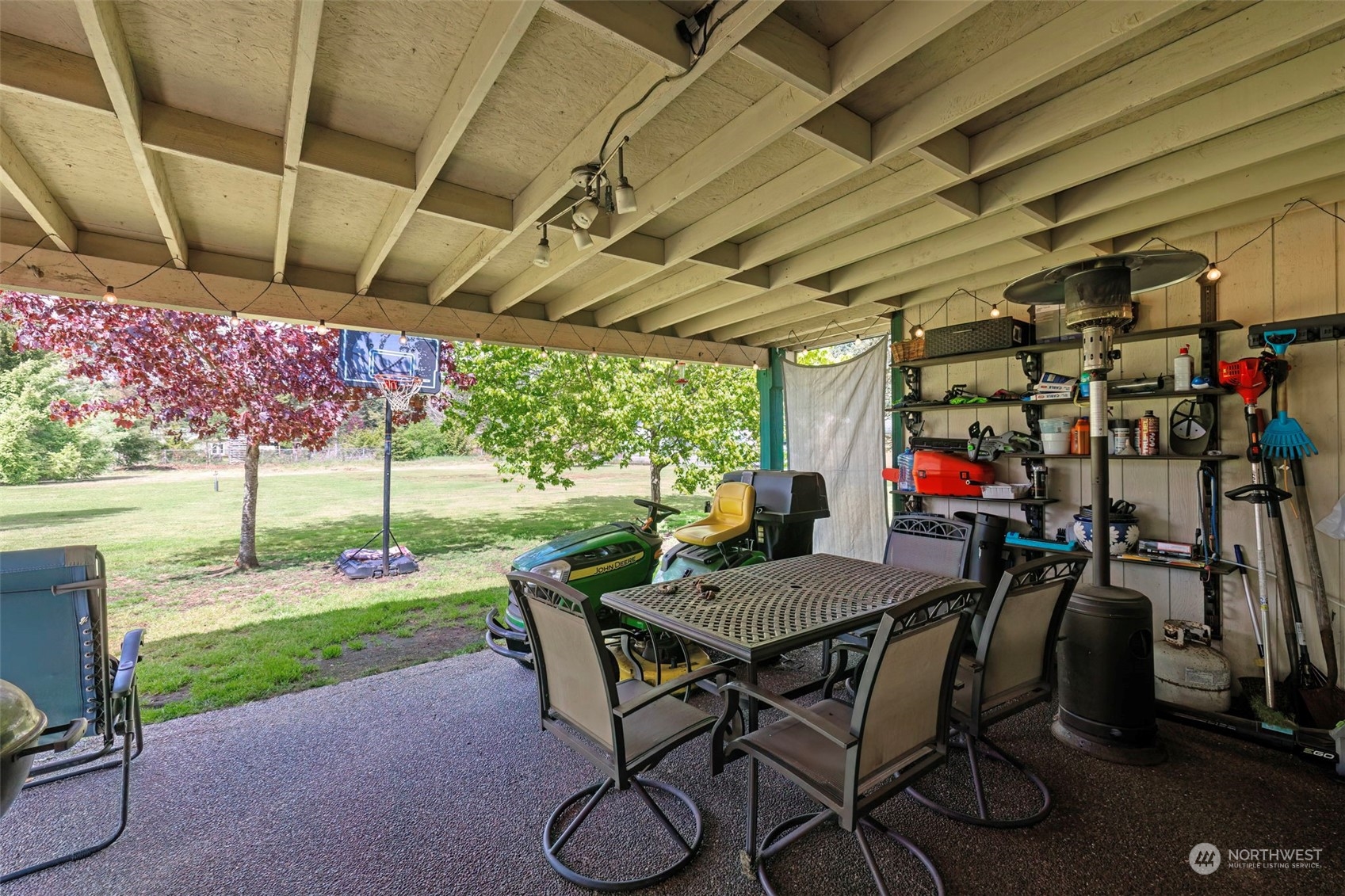 8222 178th Avenue Southwest Rochester, WA 98579 - Photo 29 of 36 a view of a patio with table and chairs and potted plants