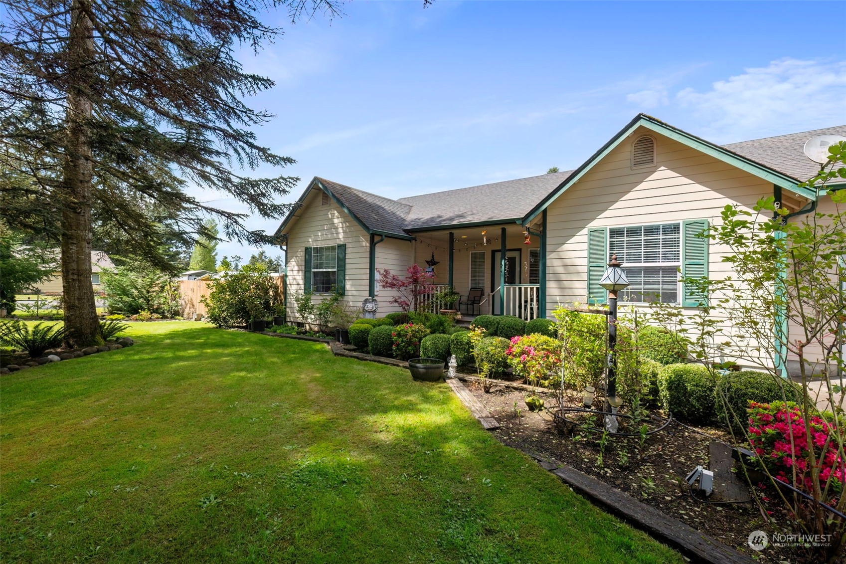 8222 178th Avenue Southwest Rochester, WA 98579 - Photo 3 of 36 a front view of a house with garden