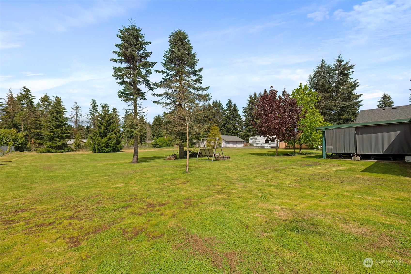 8222 178th Avenue Southwest Rochester, WA 98579 - Photo 31 of 36 a swimming pool with outdoor seating and yard