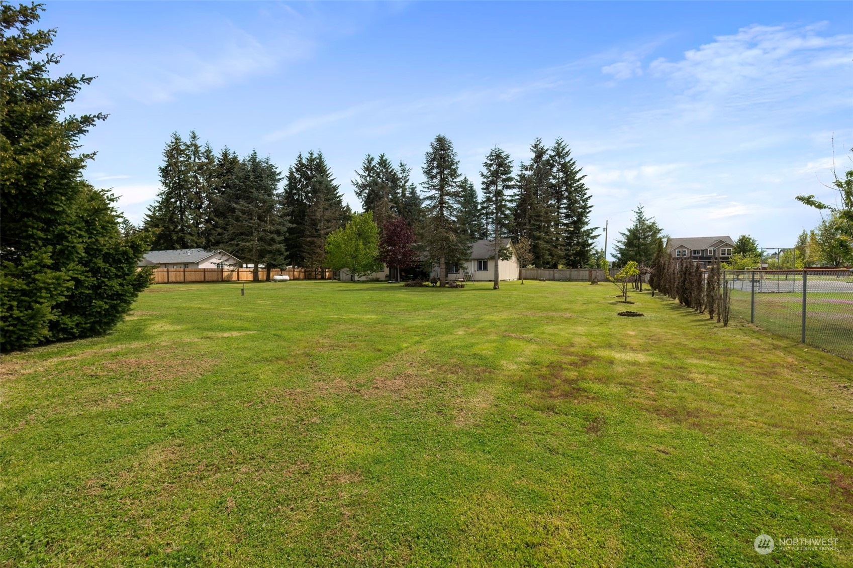 8222 178th Avenue Southwest Rochester, WA 98579 - Photo 34 of 36 a view of a big yard with trees in the background