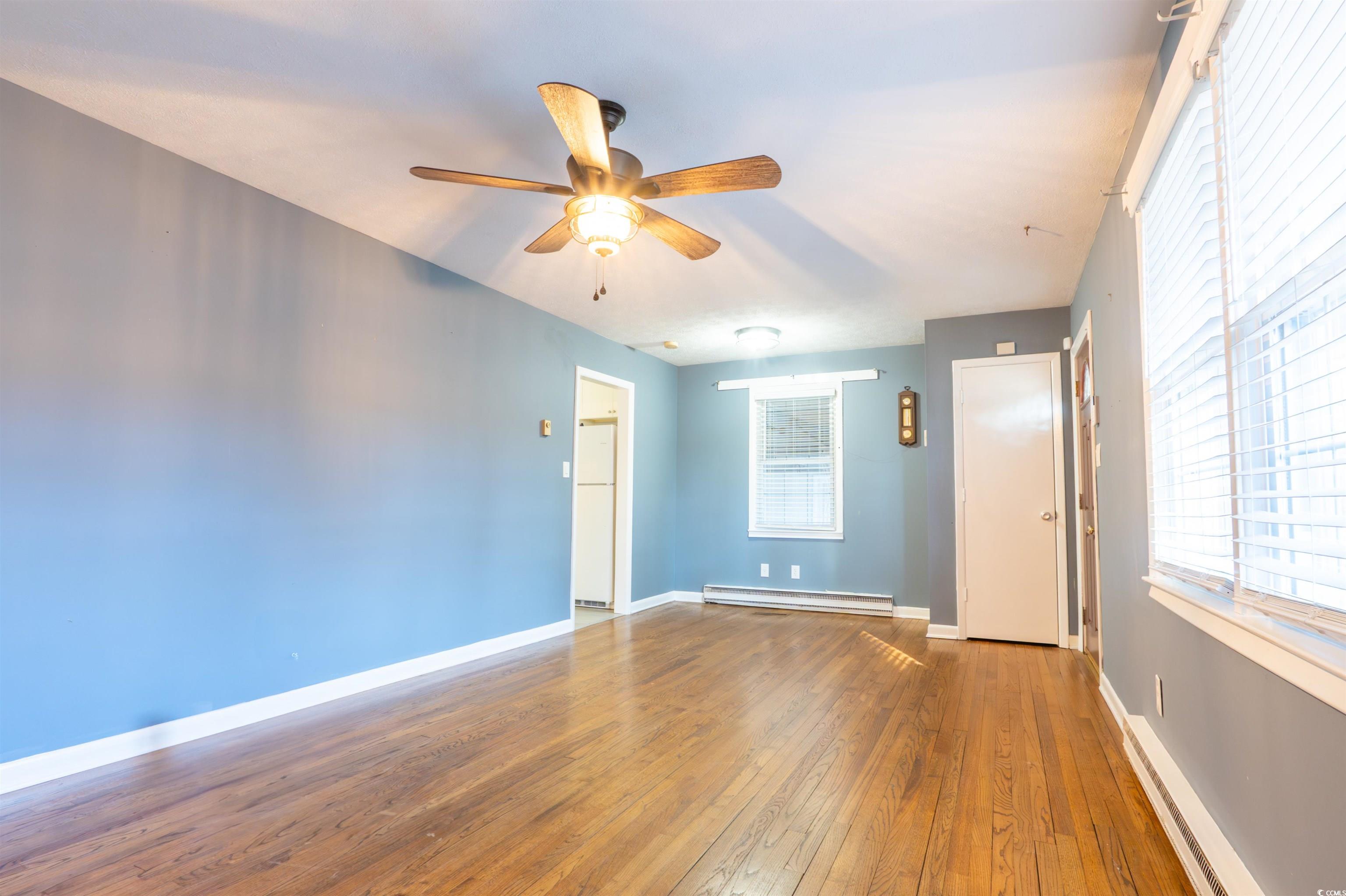 1105 Scott Drive Myrtle Beach, SC 29577 - Photo 4 of 13 Spare room featuring hardwood / wood-style floorin