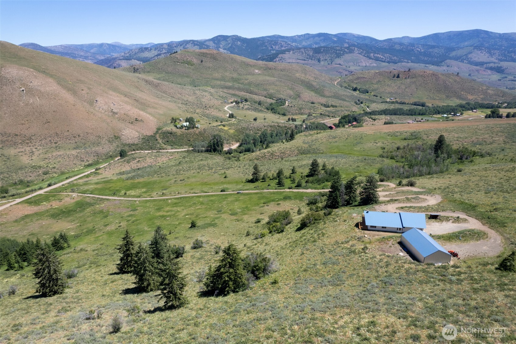 427 Rendezvous Road Winthrop, WA 98862 - Photo 5 of 40 a view of a town with mountains in the background