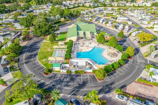 an aerial view of a house with a swimming pool yard and outdoor seating