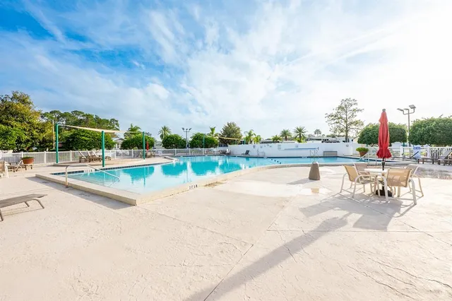 a view of a swimming pool and a yard
