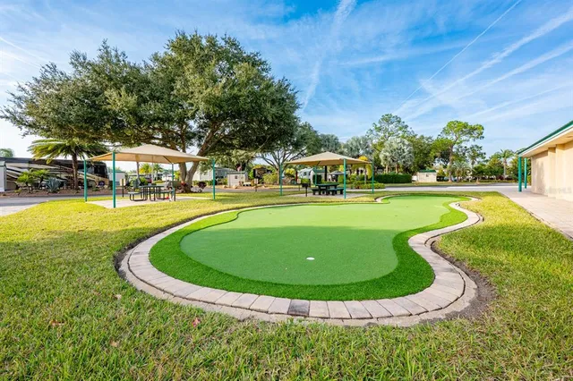 a view of a swimming pool with a yard