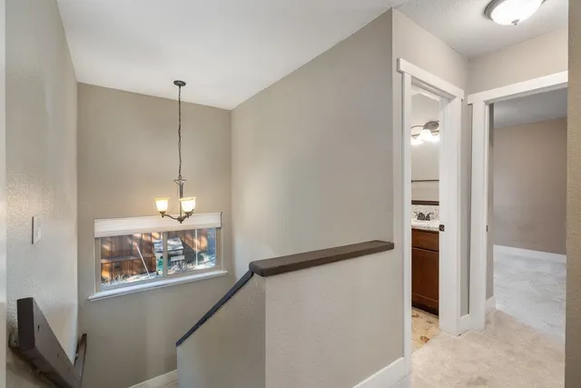 a bathroom with a granite countertop sink toilet a shower and a mirror