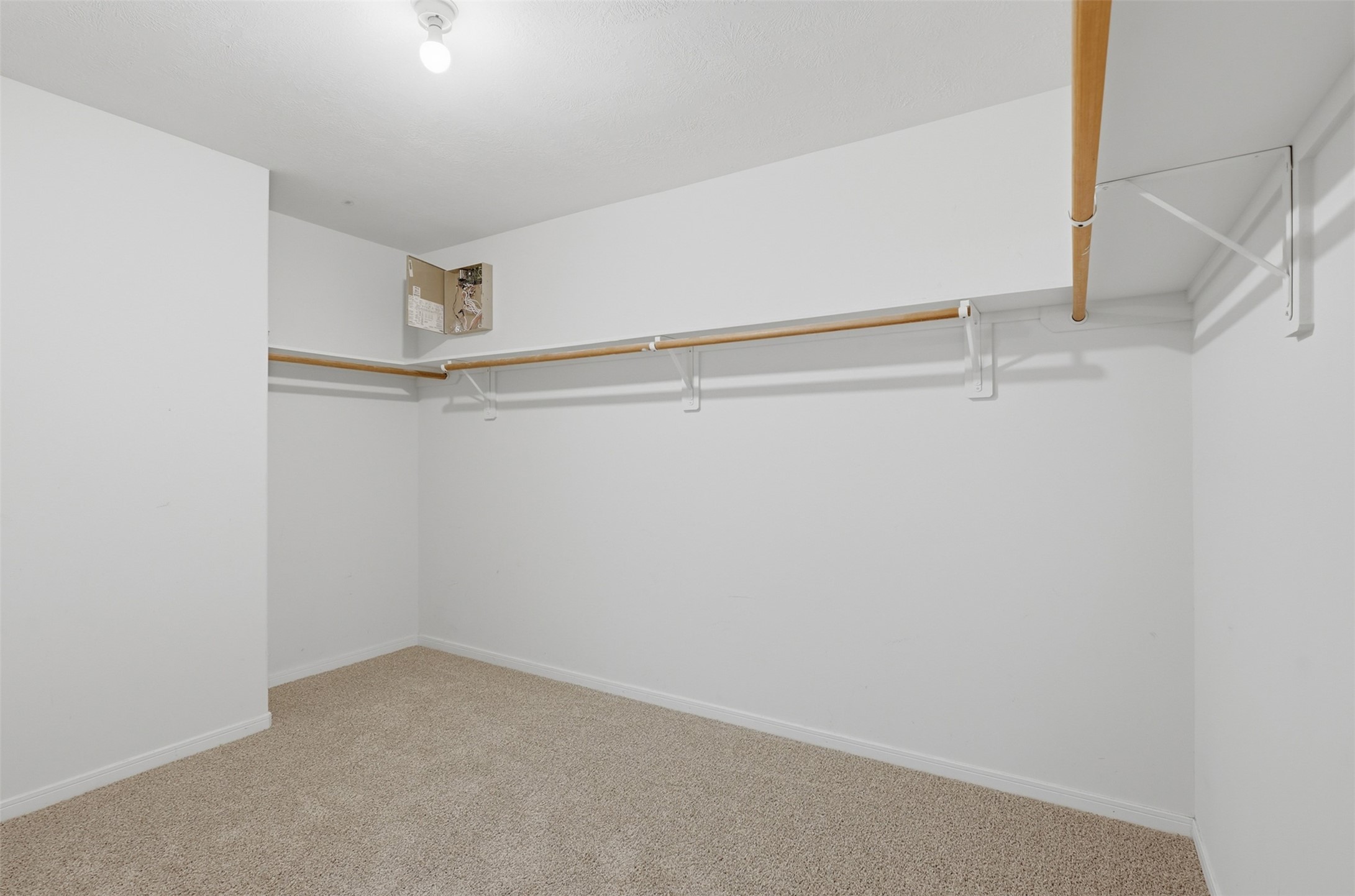 723 Slate Valley Lane Spring, TX 77373 - Photo 30 of 41 Generously sized primary walk-in closet! Features wrap-around clothes racks and top shelving with plenty of floor space for shoe racks, dressers, or custom closet organization.