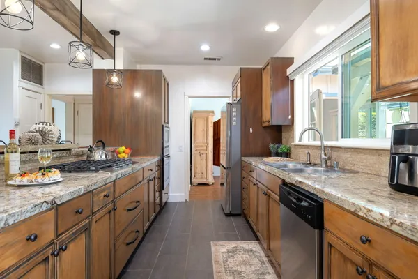 a spacious bathroom with double vanity and a large mirror