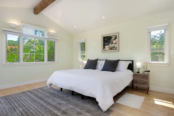 a bedroom with a bed and window
