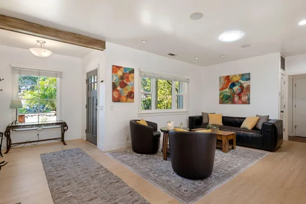 a living room with furniture window and wooden floor