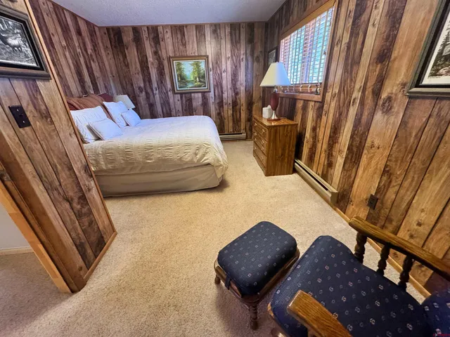 a bedroom with bed and window