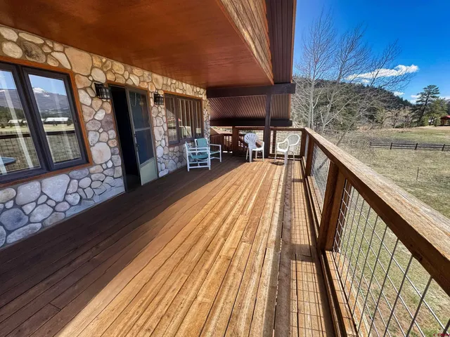 a balcony with view of outdoor space