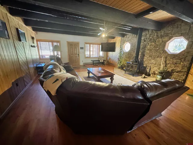 a living room with a couch and a mirror