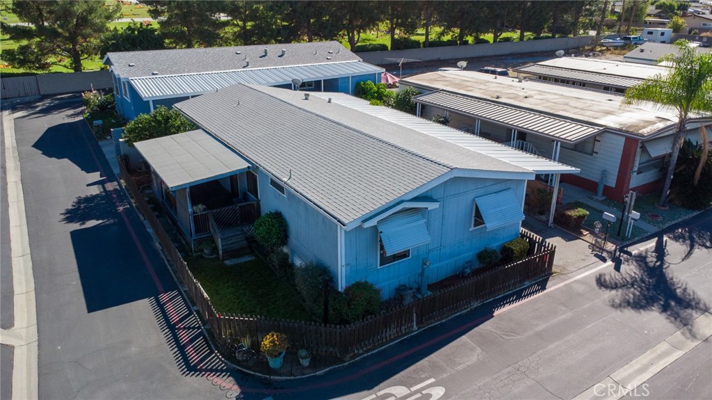 an aerial view of a house with garden space and sitting area