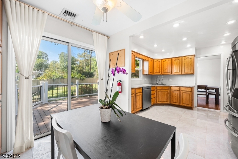 333 Old Tote Road Mountainside, NJ 07092 - Photo 17 of 48 a kitchen with stainless steel appliances granite countertop a sink a stove and a refrigerator