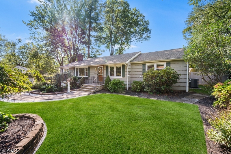 333 Old Tote Road Mountainside, NJ 07092 - Photo 2 of 48 a front view of a house with swimming pool and green space