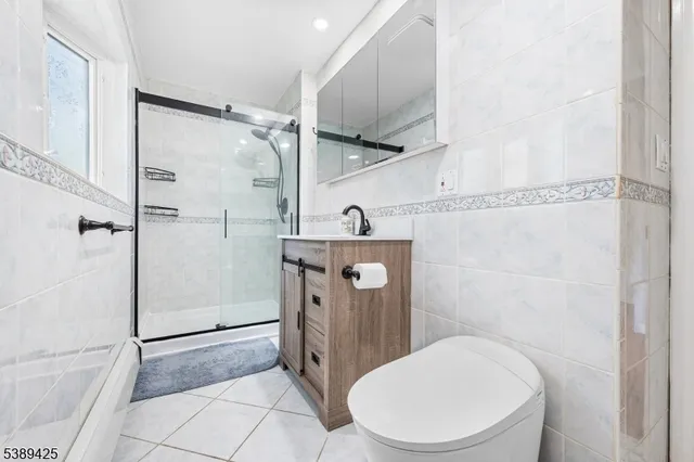 a bathroom with a toilet a sink and a shower
