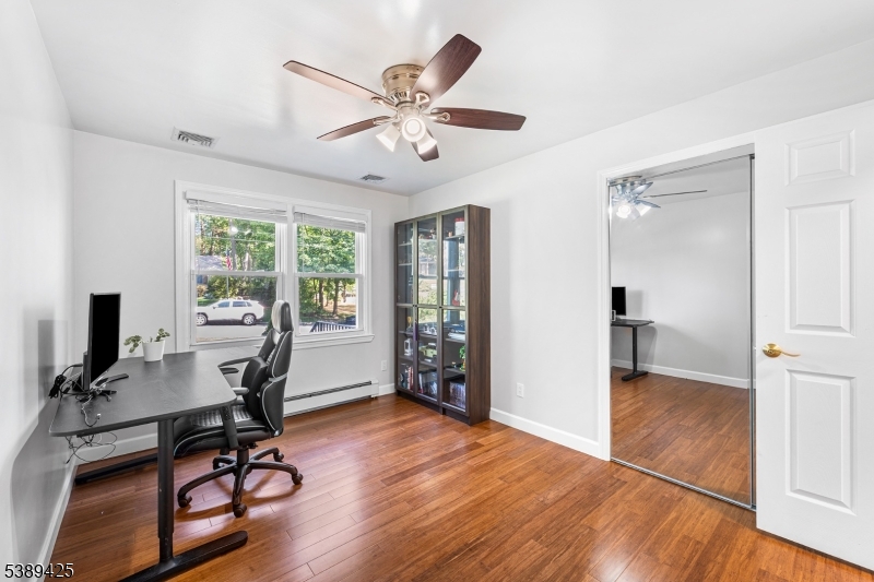 333 Old Tote Road Mountainside, NJ 07092 - Photo 24 of 48 a view of a workspace with wooden floor and a window