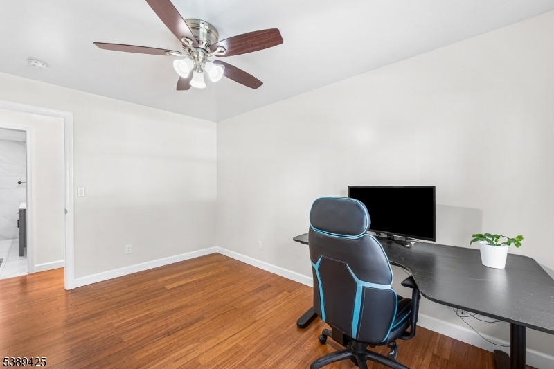 333 Old Tote Road Mountainside, NJ 07092 - Photo 25 of 48 a view of a workspace with furniture and wooden floor