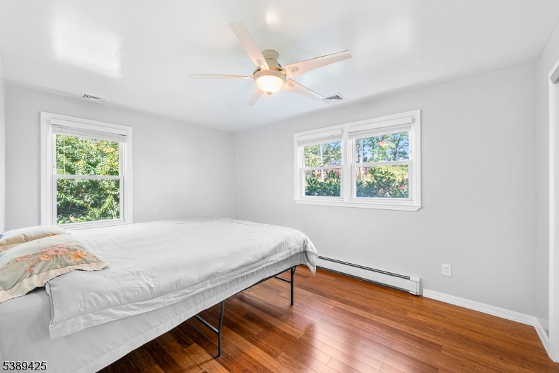 333 Old Tote Road Mountainside, NJ 07092 - Photo 31 of 48 a bedroom with a bed and a window