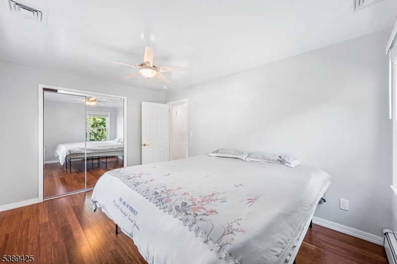 333 Old Tote Road Mountainside, NJ 07092 - Photo 33 of 48 a bedroom with a bed a dresser and window
