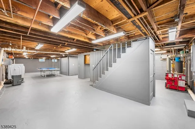 a view of storage and utility room with stairs