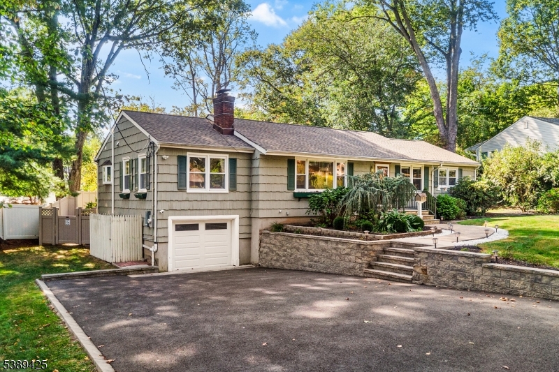 333 Old Tote Road Mountainside, NJ 07092 - Photo 4 of 48 a front view of a house with a garden