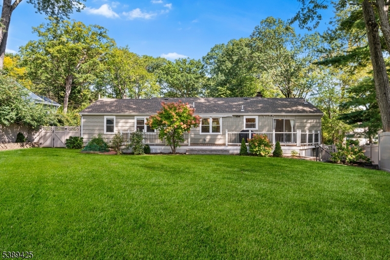 333 Old Tote Road Mountainside, NJ 07092 - Photo 44 of 48 a front view of a house with a garden and porch