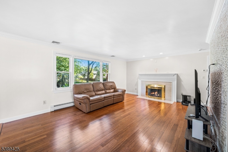 333 Old Tote Road Mountainside, NJ 07092 - Photo 6 of 48 a living room with furniture and a fireplace