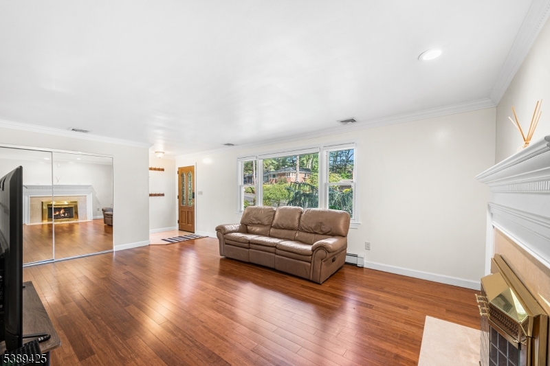 333 Old Tote Road Mountainside, NJ 07092 - Photo 7 of 48 a living room with furniture and a wooden floor