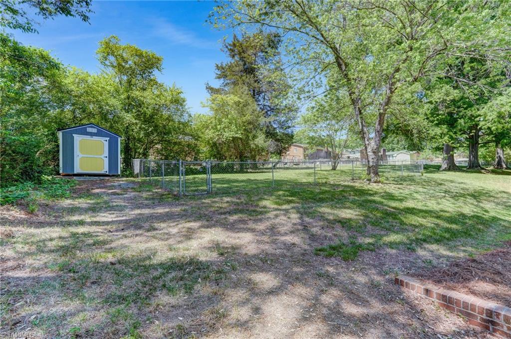 1656 Arrow Wood Road Asheboro, NC 27205 - Photo 21 of 32 The backyard has a storage building and a large fenced area that is perfect as a dog run, play area or for gardening!