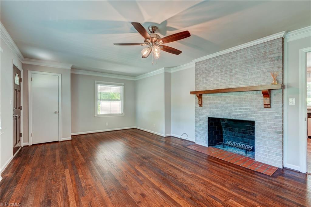 1656 Arrow Wood Road Asheboro, NC 27205 - Photo 3 of 32 Welcome home to this living area with hardwood floors and cozy fireplace!