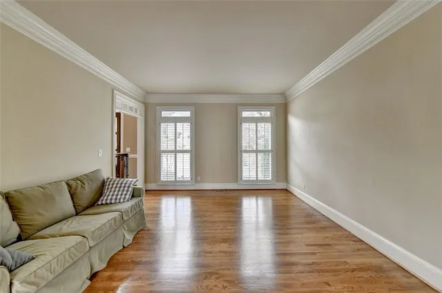 a dining room with furniture and wooden floor