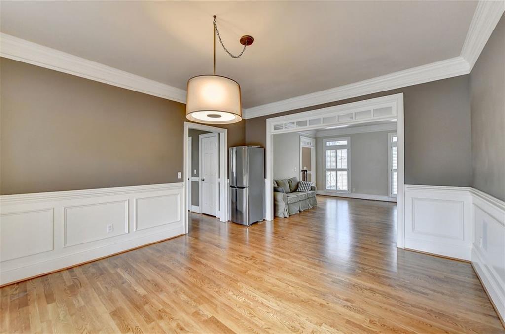 7830 Tintern Trace Duluth, GA 30097 - Photo 20 of 91 a view of empty room with wooden floor