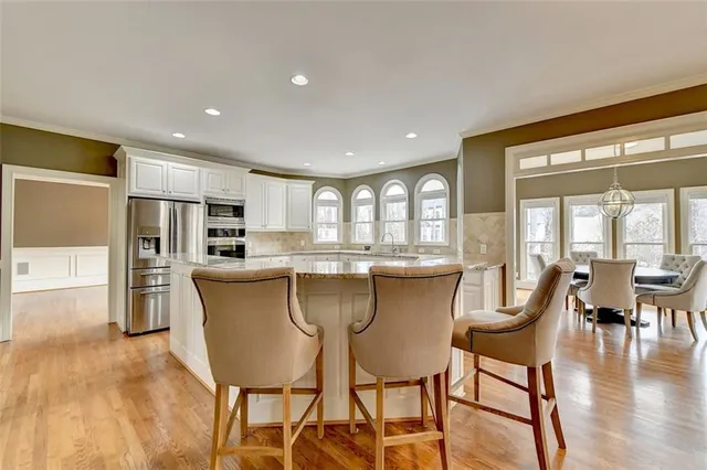 a bathroom with a toilet sink and a mirror