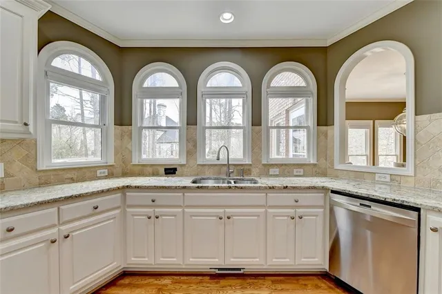 a bathroom with a sink vanity and a mirror