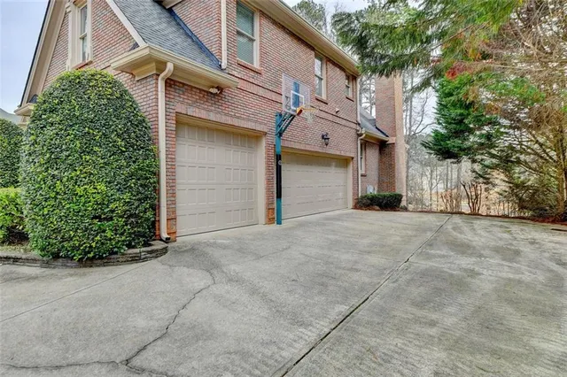 a view of staircase with wooden floor and a front door
