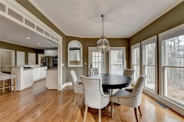 a view of a hallway with entryway wooden floor and front door