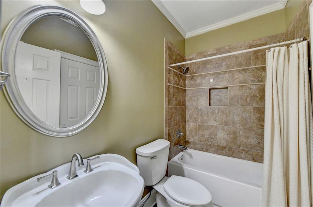 7830 Tintern Trace Duluth, GA 30097 - Photo 42 of 91 a bathroom with a toilet sink and a mirror