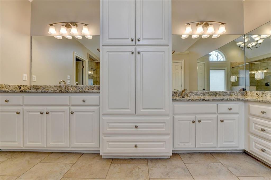 7830 Tintern Trace Duluth, GA 30097 - Photo 55 of 91 a bathroom with a sink vanity and a mirror