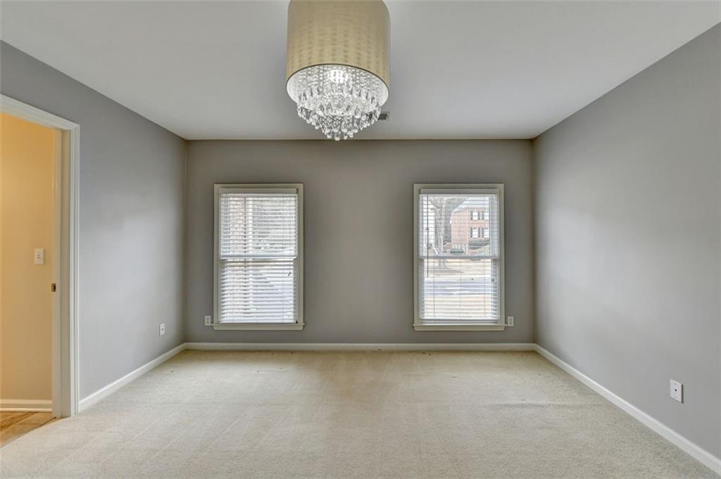 7830 Tintern Trace Duluth, GA 30097 - Photo 57 of 91 an empty room with windows